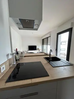 a kitchen with a sink and a counter top at Appartement T2 très bon standing ! in Ajaccio