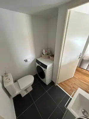 a small bathroom with a toilet and a sink at Appartement T2 très bon standing ! in Ajaccio