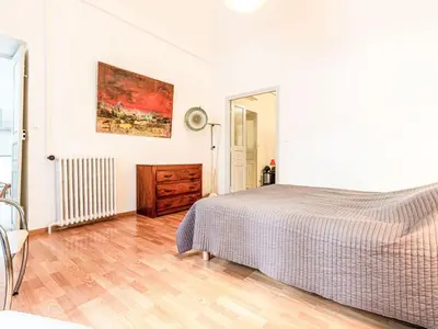 a bedroom with a bed and a wooden floor at Apartment Casa Grandval by Interhome in Ajaccio
