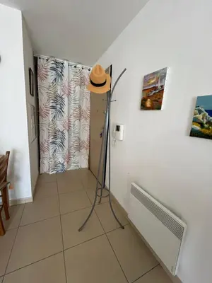 a hat is sitting on a floor in a room at MORIANI Plage T2 terrasse proche mer et commerces in Moriani Plage