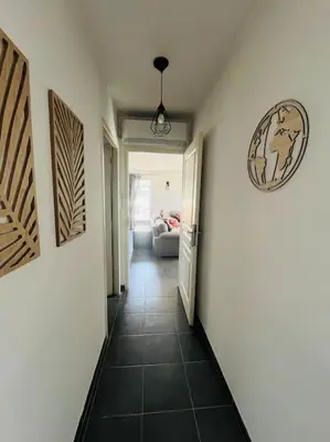 a hallway leading to a room with at Charmante Villa avec Piscine in Appietto