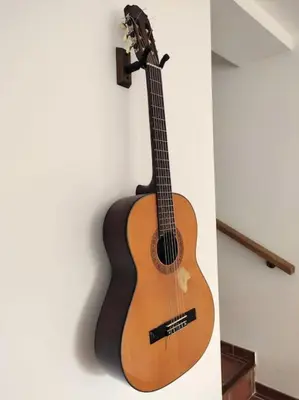 a guitar is hanging on a wall at Villa A Funtanella 100m2, paisible, vue mer in Conca