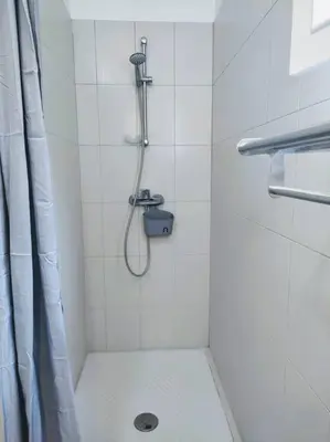 a bathroom with a shower with a shower curtain at Villa A Funtanella 100m2, paisible, vue mer in Conca