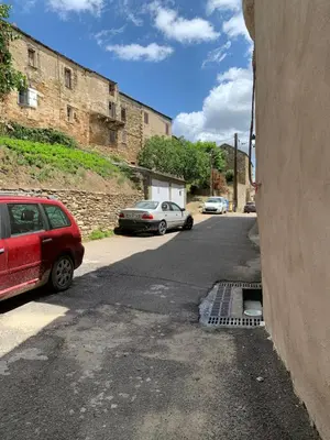 two cars parked on the side of a street at À casa nostra in Santo-Pietro-di-Tenda
