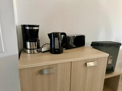 a counter with a coffee maker on top of it at Appartement Vue Mer in Sari Solenzara