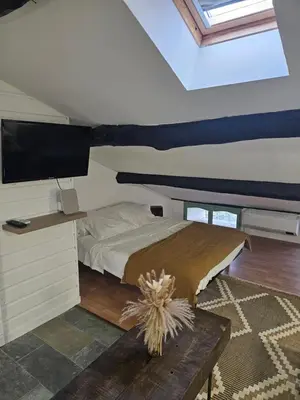 a bedroom with a bed and a flat screen tv at A Casa Di a Vita in Rapale