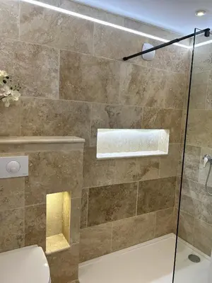 a bathroom with a shower with a glass door at La maison du Soleil in Porticcio