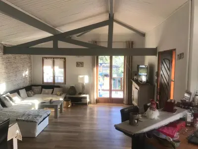 a living room with a couch and a table at Maison de vacances in Aléria