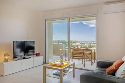 a living room with a couch and a tv and a table at Casa Ornella in Vescovato