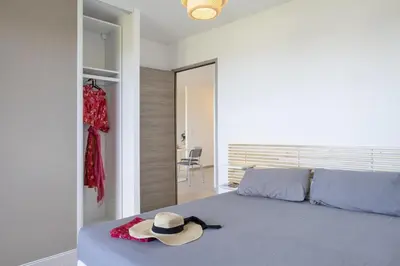 a bedroom with a bed with a hat on it at Casa Ornella in Vescovato