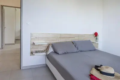 a bedroom with a large bed with a head board at Casa Ornella in Vescovato