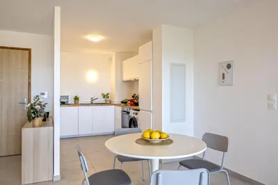 a kitchen and dining room with a table and chairs at Casa Ornella in Vescovato