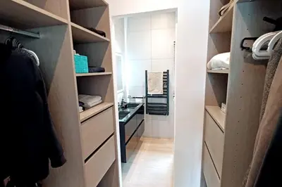 a walk in closet with drawers and a mirror at Casa di l'Alivi - Villa avec vue exceptionnelle in Propriano