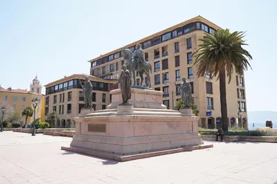 a statue in a plaza in front of a building at F3 hyper centre vieille ville coeur historique d'Ajaccio in Ajaccio