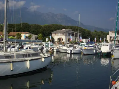 a group of boats docked in a harbor at Sole e Ventu in Velone-Orneto
