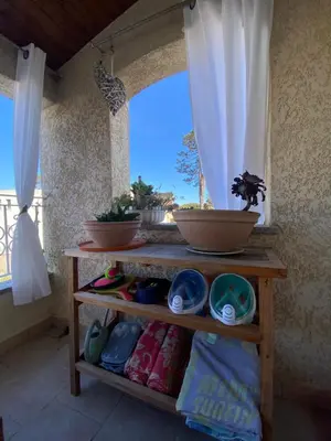 a shelf in a room with a window at Casa Sole e Mare in Borgo