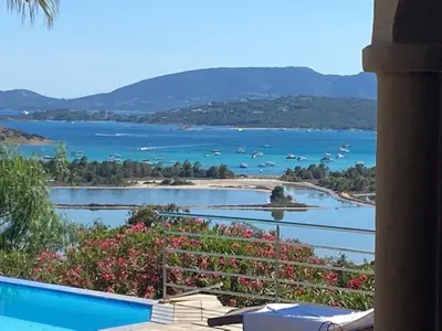 a view of a body of water with boats at Villa EDEN BLUE in Zonza