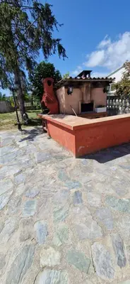 a bench sitting on top of a stone patio at Studio folelli entre le centre et la plage in Penta-di-Casinca