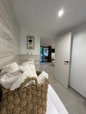 a room with a couch with towels on it at Casa Mya in Porto-Vecchio