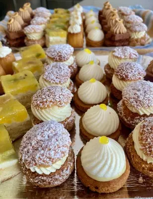 a bunch of donuts and other pastries on a table at Casa Felicia in Bonifacio