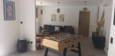 a living room with a stove and a couch at Casa Sophie in Capo