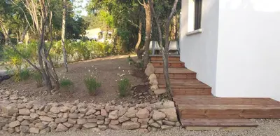 a staircase leading up to a house with a pile of rocks at Casa Sophie in Capo