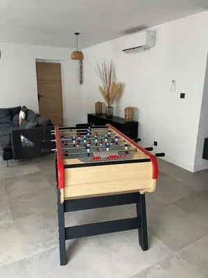 a large billiard table in a living room at Casa Sophie in Capo