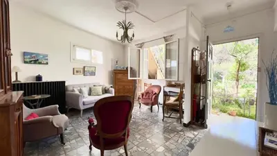 a living room with a couch and a chair at Casamea - Spacieux, Famille, Hyper-centre in Ajaccio