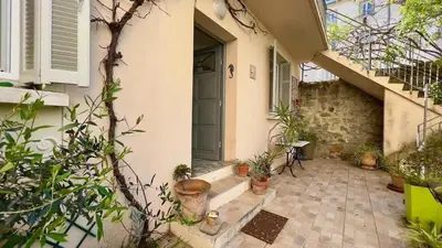 an entrance to a house with potted plants at Casamea - Spacieux, Famille, Hyper-centre in Ajaccio