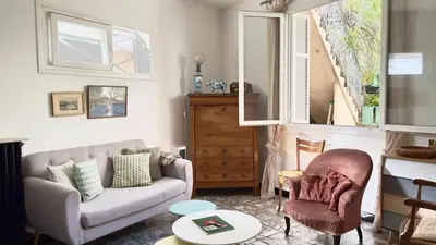a living room with a couch and a chair at Casamea - Spacieux, Famille, Hyper-centre in Ajaccio