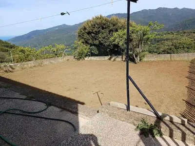 a large dirt field with a pole on the ground at Maison à 15 minutes de Propriano in Santa-Maria-Figaniella