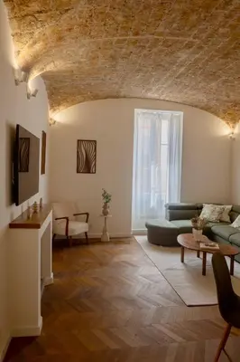 a living room with a couch and a table at Liviamariasanta in Ajaccio