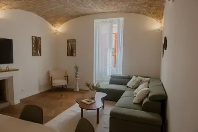 a living room with a couch and a table at Liviamariasanta in Ajaccio