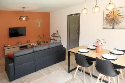 a living room with a couch and a table at Casa Solana - Piscine privée in Galeria