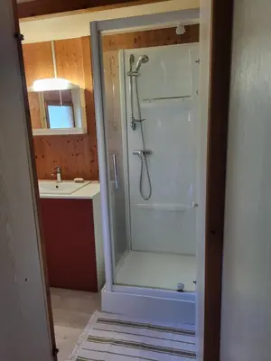 a bathroom with a shower and a sink at Chalet Cosy - U Nestru in Olmeto