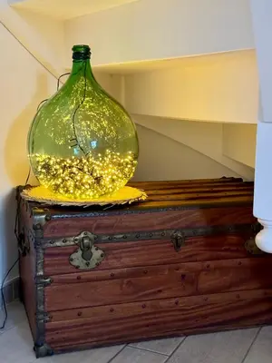 a glass jar sitting on top of a chest at Evasion de rêve à Casa Nina in Borgo