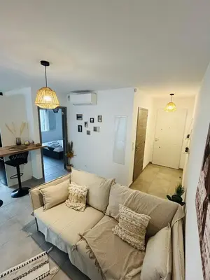 a living room with a couch and a table at Appartement T2 Corte in Corte