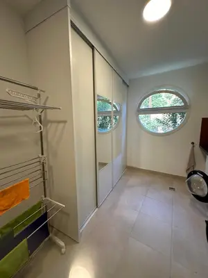 a bathroom with a walk in shower and two windows at Appartement de standing, vue mer, 3 chambres in Ajaccio