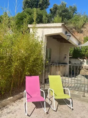two chairs sitting in front of a house at Meacci in Borgo