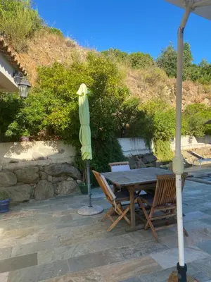 a table and chairs and an umbrella on a patio at Meacci in Borgo