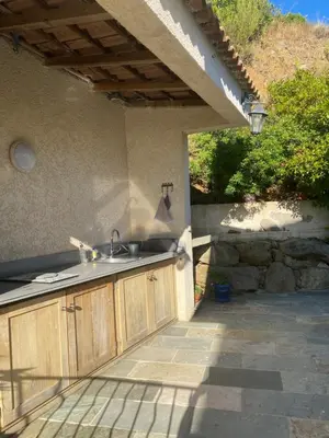 a kitchen with a sink on a patio at Meacci in Borgo