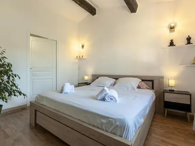 a bedroom with a bed with two towels on it at Holiday Home Casa Germaine by Interhome in Porto-Vecchio