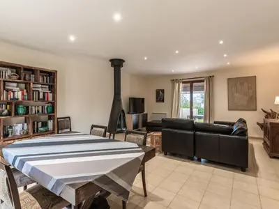 a living room with a couch and a table at Holiday Home Agula Marina by Interhome in Moriani Plage