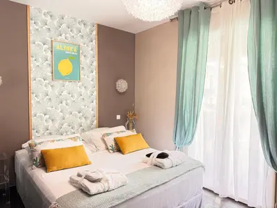 a bedroom with a bed with towels on it at Résidence COMAEM in Sarrola-Carcopino