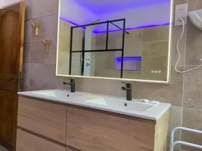 a bathroom with a sink and a mirror at Residence ELLADA 1 in Cargèse