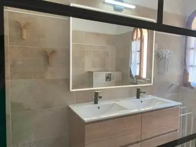 a bathroom with a sink and a mirror at Residence ELLADA 1 in Cargèse