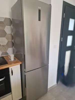 a stainless steel refrigerator in a small kitchen at Maison pour 4 personnes en bord de mer in Borgo