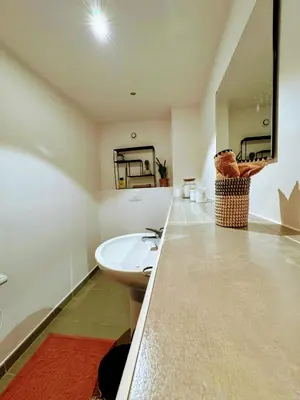 a bathroom with a sink and a tub and a mirror at Casa Carlu Maria III in Corte