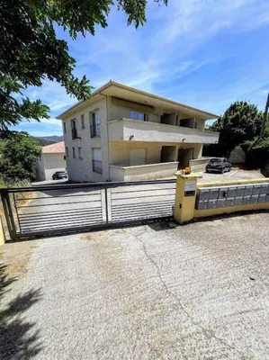 a house with a fence in front of it at Casa Carlu Maria III in Corte