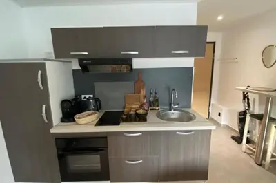 a kitchen with a sink and a counter top at Casa Carlu Maria II in Corte
